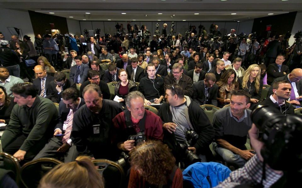 Journalists wait for NBA Commissioner Adam Silver to address a news conference in New York, Tuesday, April 29, 2014. Silver announced that Los Angeles Clippers owner Donald Sterling has been banned for life by the league in response to racist comments the league says he made in a recorded conversation. (AP Photo/Richard Drew)