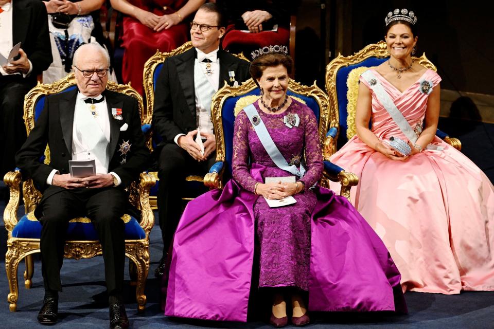 King Carl XVI Gustaf of Sweden (L), Crown Prince Daniel of Sweden, Queen Silvia of Sweden and Crown Princess Victoria of Sweden attend the Nobel Prize ceremony at the Konserthuset in Stockholm on December 10, 2022.