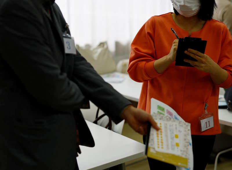 Participants have conversation at a matchmaking event using mystery solving game, which is organized by Tokyo metropolitan government at Jindai Botanical Gardens in Tokyo