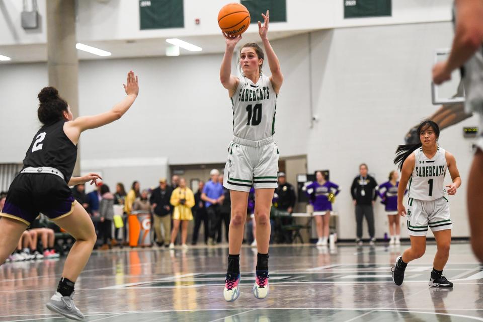 Fossil Ridge's Ella Lavigne sinks a 3-pointer in a girls high school basketball game against Fort Collins at Fossil Ridge High School on  Jan. 31 in Fort Collins.