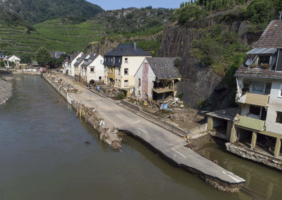 The village street in Mayschoß is swept away by the flood wave, Germany, July 20, 2021. Numerous houses in the village were completely destroyed or severely damaged. (Boris Roessler/dpa via AP)