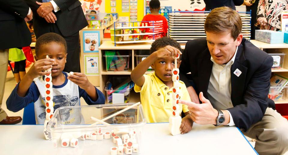 Bill Poole interacts with pre-kindergarten students at Taylorville Primary School in this 2017 file photo. Poole, who now serves as state finance director, said a proposed health-care focused high school in Demopolis could help solve Alabama's acute shortage of health-care workers in rural areas. [Staff Photo/Gary Cosby Jr.]