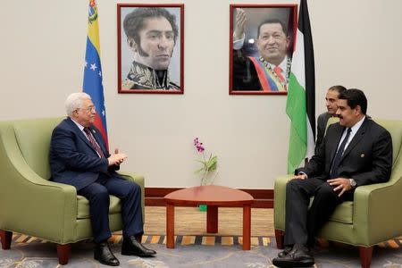 Venezuela's President Nicolas Maduro (R) speaks with Palestinian President Mahmoud Abbas (L) in Porlamar, Venezuela September 16, 2016. Miraflores Palace/Handout via REUTERS