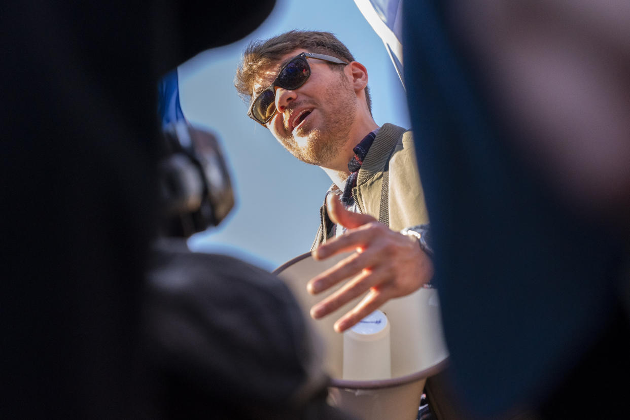 FILE - Nick Fuentes, right-wing podcaster, speaks at a pro-Trump march, Nov. 14, 2020, in Washington. A surge of anti-Jewish vitriol, spread by a world-famous rapper, an NBA star and other prominent people, including Fuentes, is stoking fears that public figures are normalizing hate and ramping up the risk of violence in a country already experiencing a sharp increase in antisemitism. (AP Photo/Jacquelyn Martin, File)