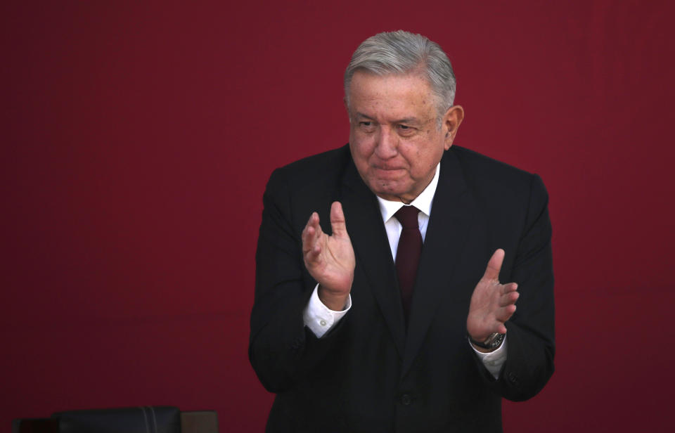 FILE - In this Feb. 9, 2021 file photo, Mexican President Andres Manuel Lopez Obrador applauds during a ceremony at Chapultepec Castle in Mexico City. Mexico announced Saturday, April 24, 2021, that Lopez Obrador will hold talks with U.S. Vice President Kamala Harris on May 7 to discuss migration, amid an increase in underage migrants at the U.S. southern border. (AP Photo/Marco Ugarte, File)