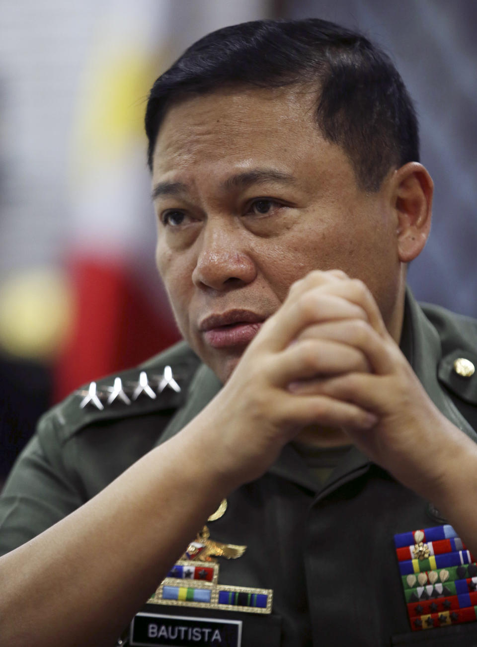 Philippine Military Chief Emmanuel Bautista answers questions during an interview at Camp Aquinaldo military headquarters in suburban Quezon city, north of Manila, Philippines on Thursday, Feb. 20, 2014. Bautista says Beijing’s territorial claims in the South China Sea are “nonsense” and vowed to defend fishermen if they face intimidation by Chinese naval forces in the waters. (AP Photo/Aaron Favila)