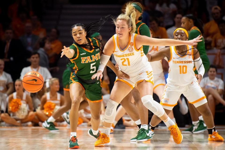 Florida A&M point guard Ahriahna Grizzle (5) and Tennessee guard/forward Tess Darby (21) reach for a loose ball during a game between Tennessee and Florida A&M in Knoxville on Tuesday, November 7, 2023.