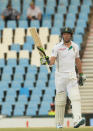South Africa's batsman AB de Villiers, raises his bat after reaching a half century on the second day of their their cricket test match against Australia at Centurion Park in Pretoria, South Africa, Thursday, Feb. 13, 2014. (AP Photo/Themba Hadebe)
