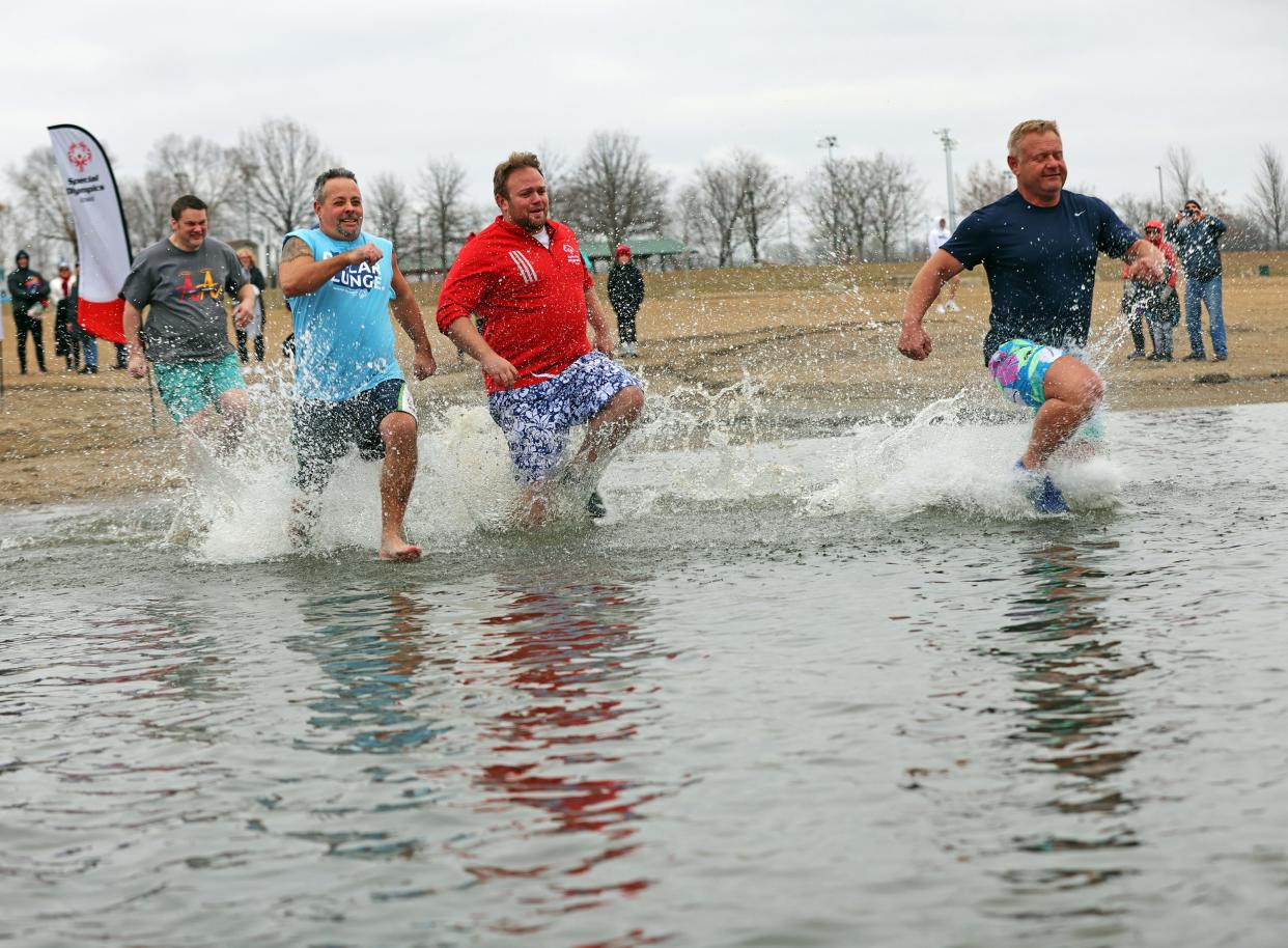 Teams have fun during the annual Polar Plunge, which raised money in support of Special Olympics Iowa. More than 220 participants braved the frigid waters at the Raccoon River Park beach in West Des Moines on Saturday, Dec. 2, 2023.