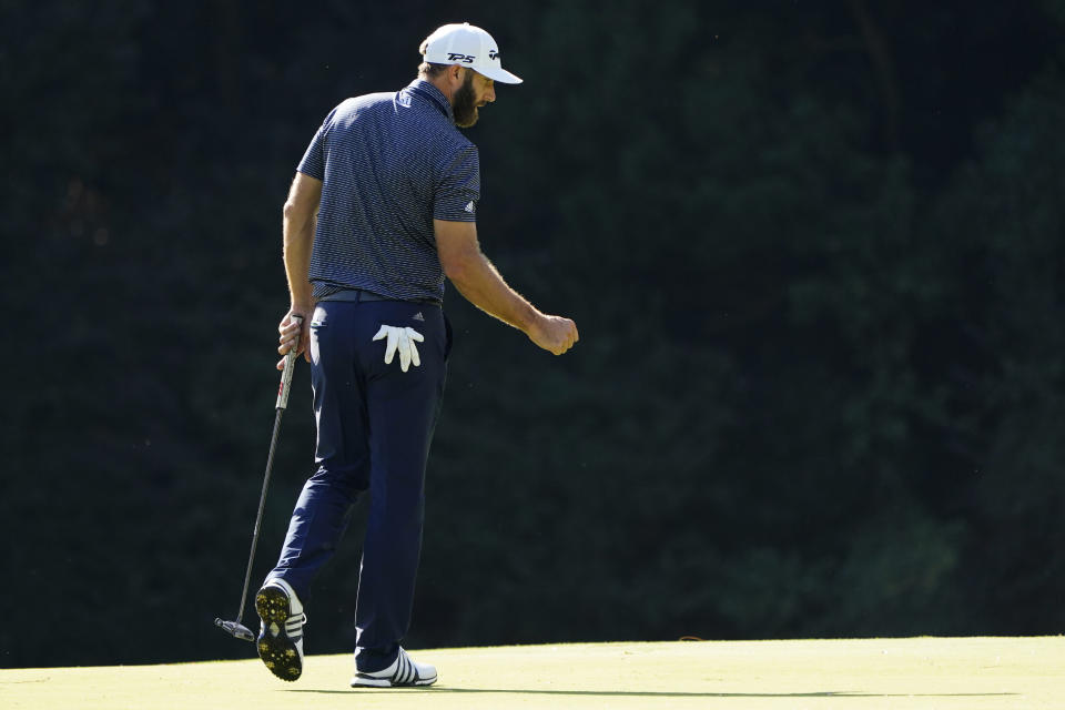 Dustin Johnson pumps his fist after a birdie on the 15th green during the final round of the Masters golf tournament Sunday, Nov. 15, 2020, in Augusta, Ga. (AP Photo/Matt Slocum)