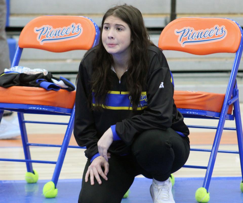 Taryn Martin, a 2021 graduate of Olentangy Orange and two-time girls wrestling state champion, is in her first season as coach at Olentangy.