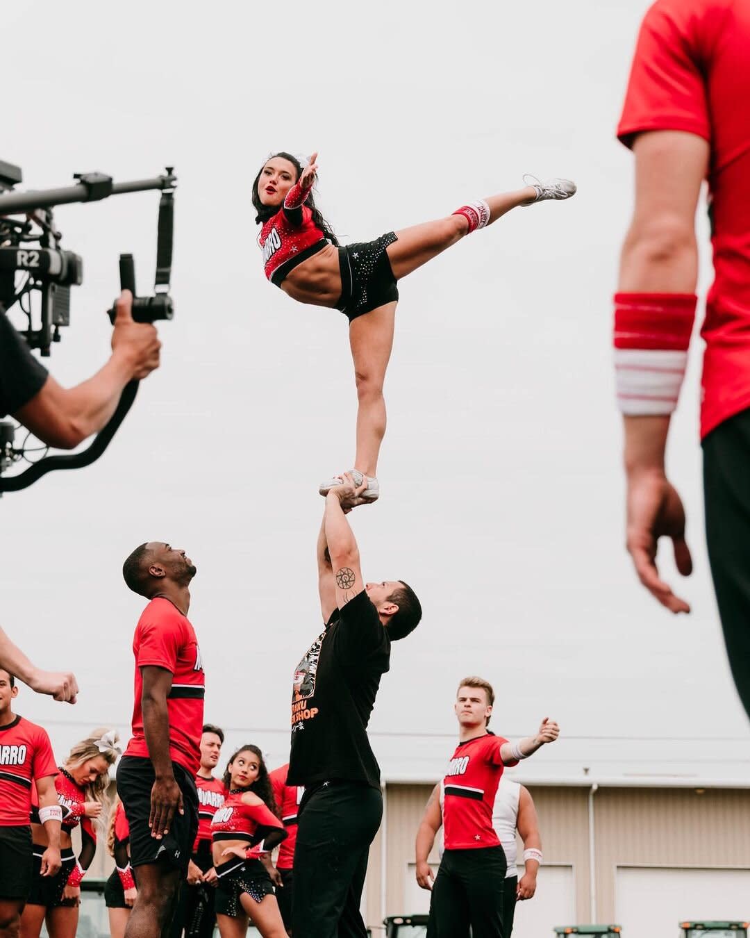 Maddy Brum as a flyer in the Navarro cheer team