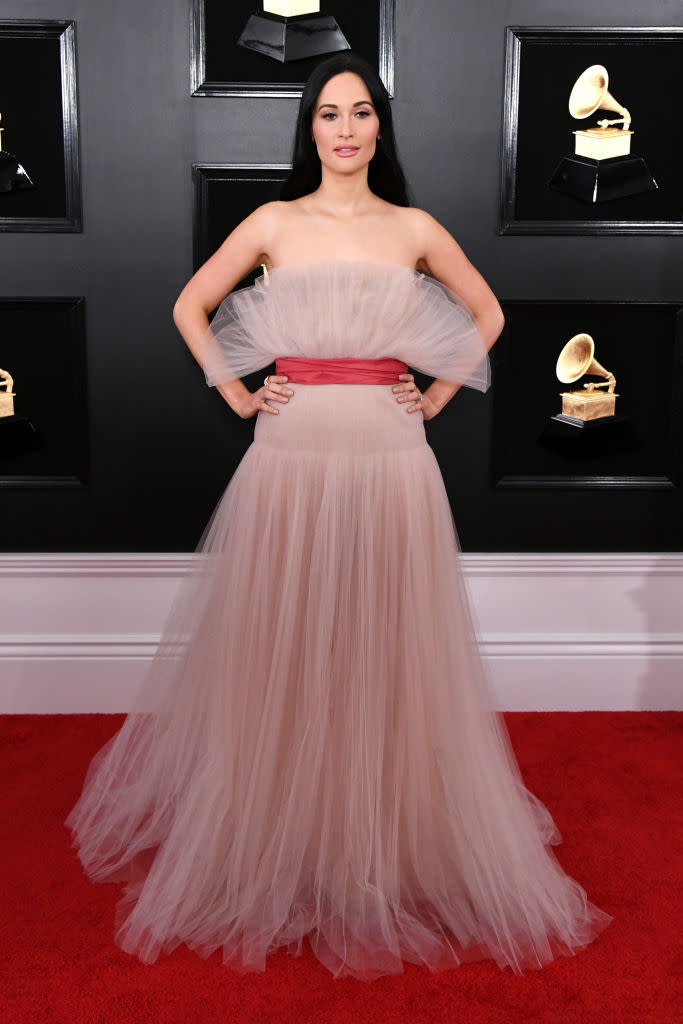 <p>On her big night, performing and winning awards for her album <i>The Golden Hour</i>, Kacey Musgraves chose a strapless, soft pink tulle gown for her arrival. </p>