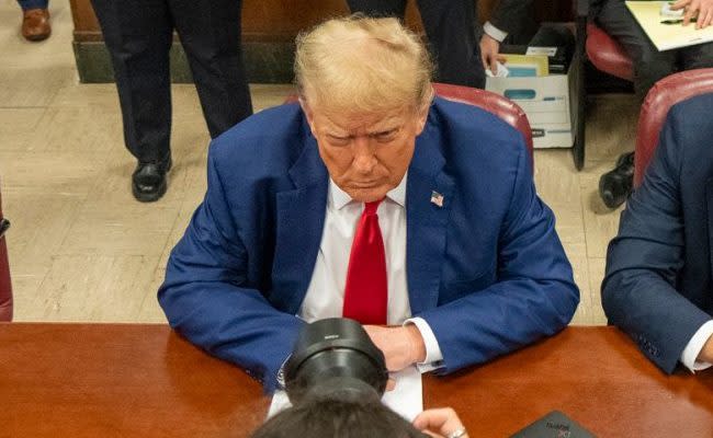 Donald Trump sits in the courtroom at Manhattan criminal court in New York on Monday