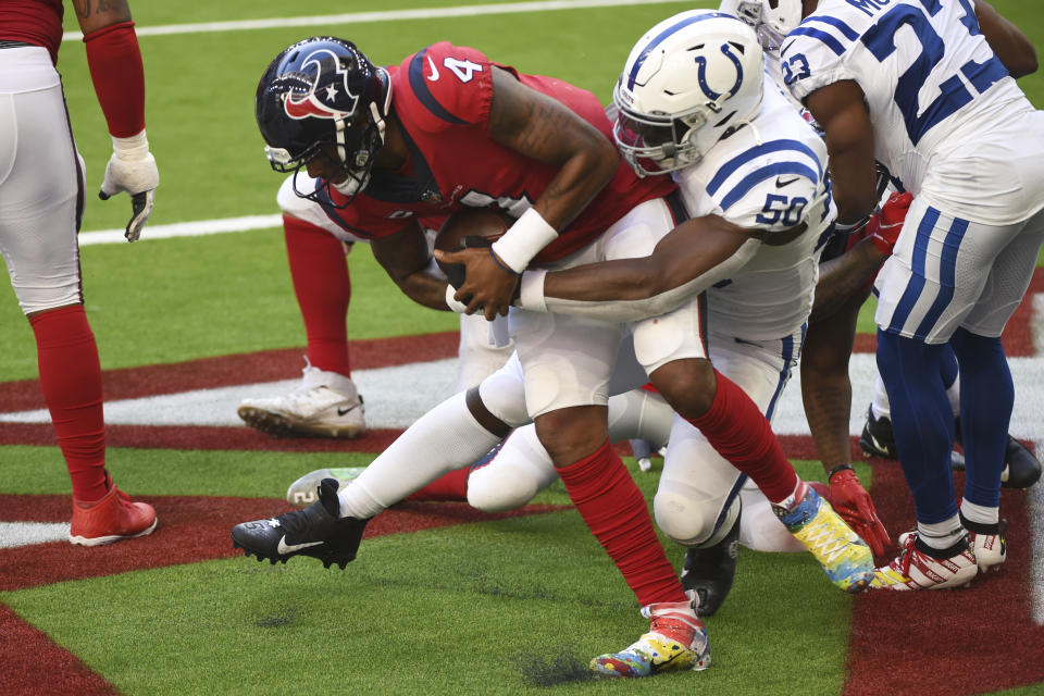 Houston Texans quarterback Deshaun Watson (4) is sacked by Indianapolis Colts defensive end Justin Houston (50) for a safety during the second half of an NFL football game Sunday, Dec. 6, 2020, in Houston. (AP Photo/Eric Christian Smith)