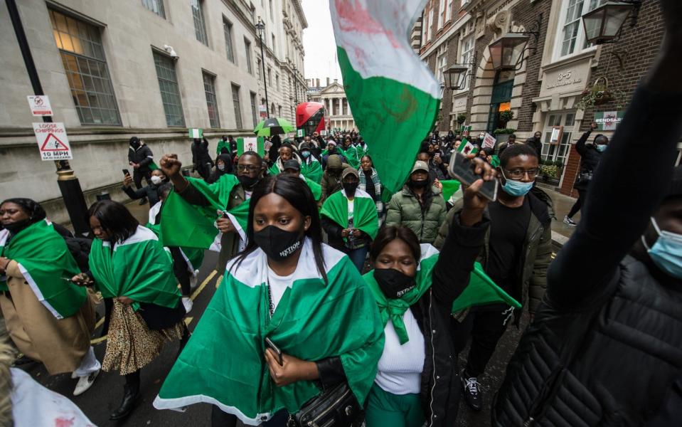 Protestors chant slogans outside the Nigerian High Commission in London  - Getty Images Europe 