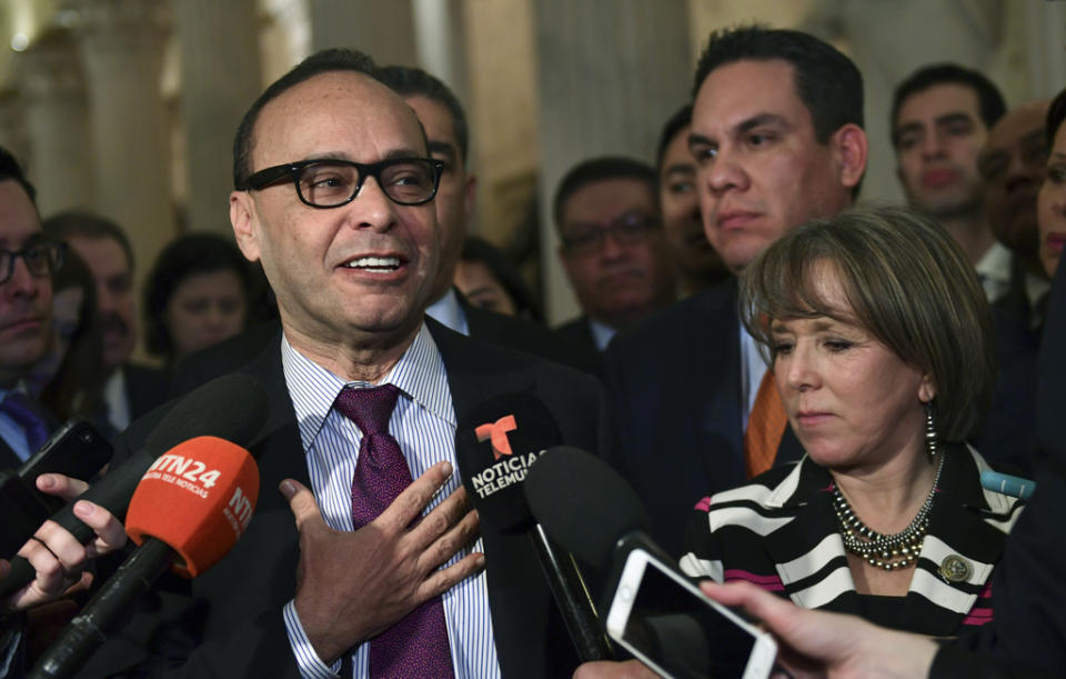 Rep. Luis Gutierrez, D-Ill., left, with Rep. Michelle Lujan Grisham, D-N.M., right, and Rep. Pete Aguilar, D-Calif., second from right