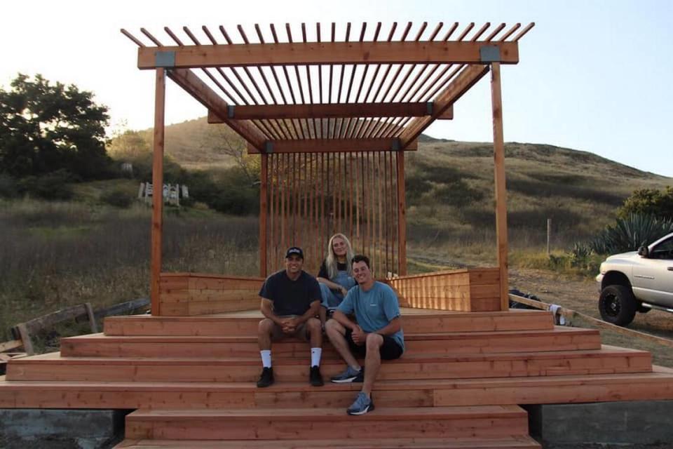 Two 2019 Cal Poly construction management graduates, Tony Pellegrini (left) and Harrison Woods (right), built the first permanent structure in ‘Architecture Graveyard’ in 15 years. Sitora Vaxidova (middle) was one of the designers.