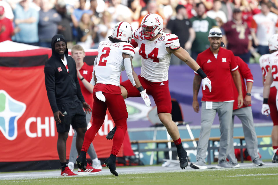 Nebraska wide receiver Isaiah Garcia-Castaneda (2) celebrates with a teammate after catching a 32-yard touchdown pass during the first half of an NCAA college football game against Northwestern, Saturday, Aug. 27, 2022, at Aviva Stadium in Dublin, Ireland. (AP Photo/Peter Morrison)