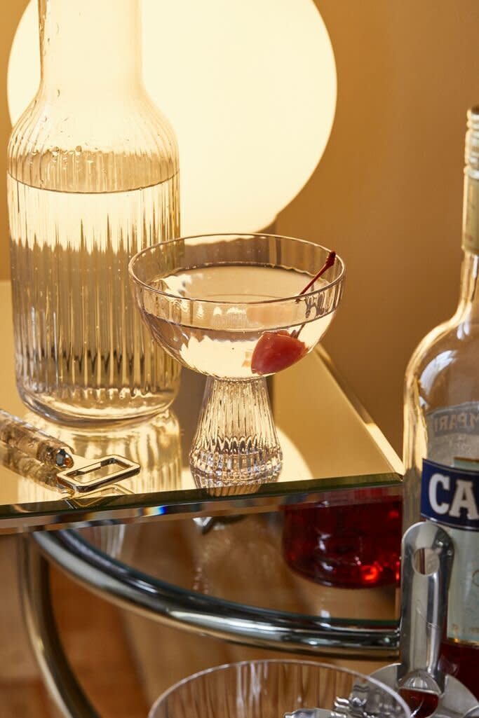 Surprise them with another addition to their glassware collection with a vintage-inspired coupe glass that looks like it came off the set of "Mad Men." It'll be just the thing their <a href="https://www.huffpost.com/entry/beautiful-mini-bar-carts-for-small-spaces-and-every-budget_l_5f466fcbc5b697186e2f78cc" target="_blank" rel="noopener noreferrer">bar cart</a> needs. <a href="https://fave.co/3qDBpCA" target="_blank" rel="noopener noreferrer">﻿Find it for $10 at Urban Outfitters</a>.