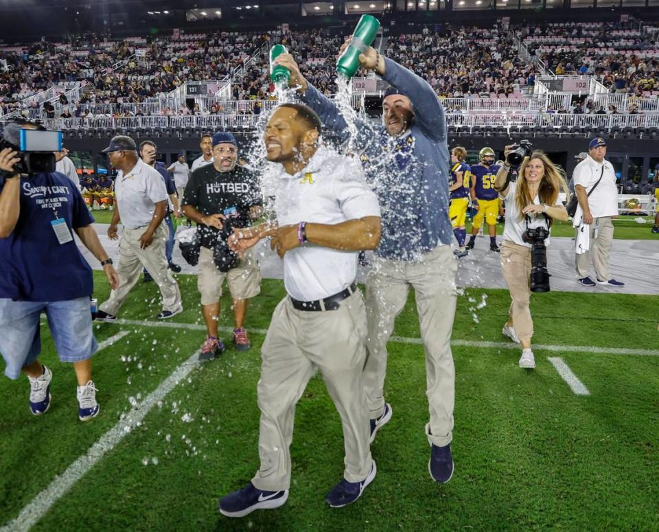 St. Thomas Aquinas football head coach Roger Harriott is doused with water as the team celebrates defeating the Homestead Broncos during the 2022 FHSAA State Championships-Class 3M at DRV PNK Stadium in Ft. Lauderdale on Thursday, December 15, 2022.