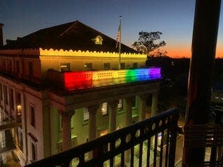 Rainbow colors are displayed on the Hippodrome Theatre.