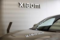 Xiaomi's first electric vehicle SU7 is displayed at a showroom of a newly opened Xiaomi store in Beijing