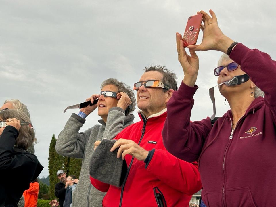 From right to to left: Cheryl Kurchin Chapman, Greg Fisher, Joan Flanders, Paula Staight and Diane Lang gather to view the Oct. 14, 2023 solar eclipse at College Hill Reservoir in Eugene. Another solar eclipse is expected to be visible from most of the U.S., including Oregon, on April 8.