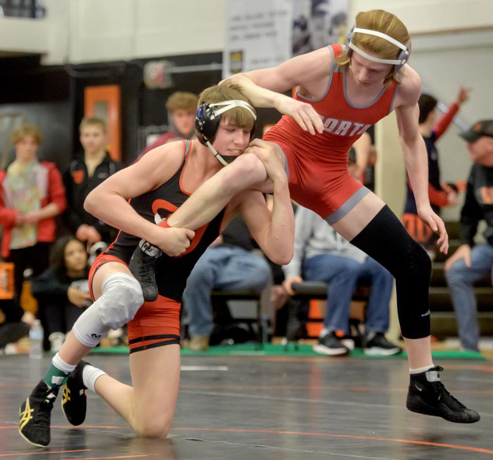 Washington's Kannon Webster, left, tries to take down Morton's Steve Marvin in the 132-pound division of the Class 2A wrestling regional final Saturday, Feb. 5, 2022 at Washington Community High School. Webster advanced with a pin.