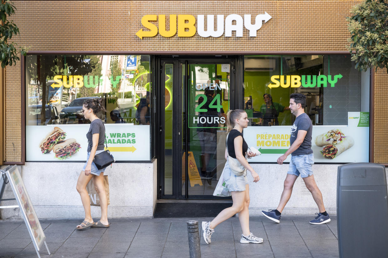 MADRID, SPAIN - 2023/08/16: Pedestrians walk past the American sandwich fast food restaurant franchise Subway store in Spain. (Photo by Xavi Lopez/SOPA Images/LightRocket via Getty Images)