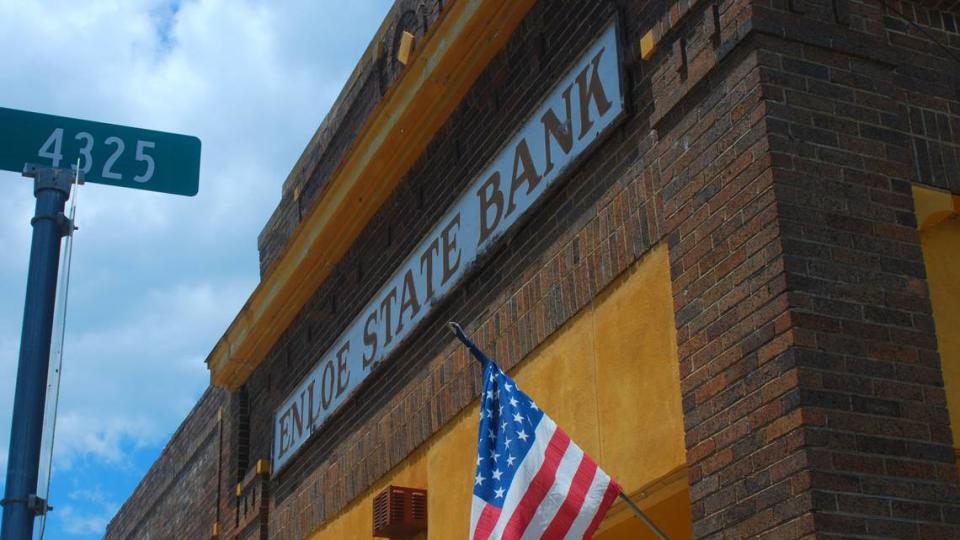 The sign on the old Enloe State Bank building in the unincorporated settlement of Enloe, Texas, is pictured on July 13, 2019. The bank, founded in 1928, helped Delta County cotton farmers get through the season with loans and eventually attracted customers from as far away as Dallas. The brick building in Enloe closed in 2008, and the bank’s headquarters moved to Cooper.