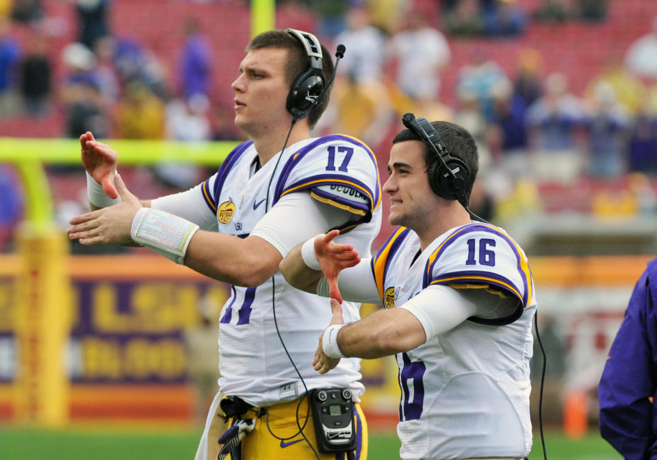 Former LSU QB Brad Kragthorpe #16 helps signal a play against Iowa in 2014. (Photo by Al Messerschmidt/Getty Images)