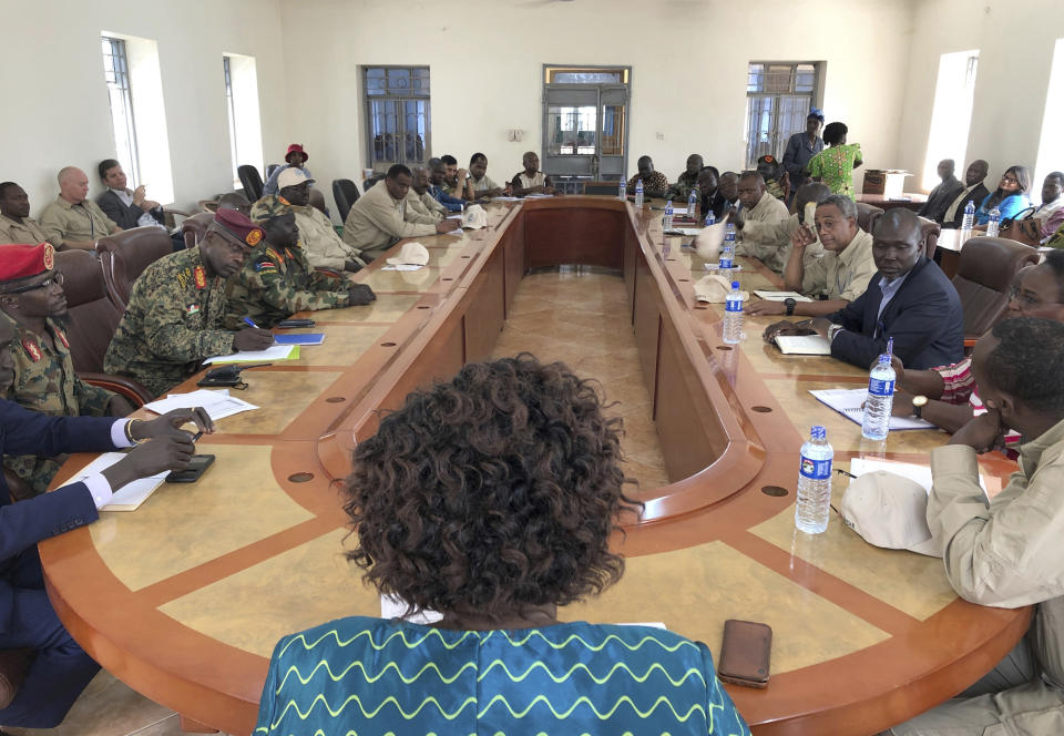 In this photo dated Thursday, Jan. 1 2019, Government and opposition forces come together for one of many meetings aimed at building confidence for a peace deal between the opposing forces, in the town of Yambio, South Sudan, although the meeting deteriorated with both sides accused of recruiting forces and using child soldiers. Officials sad Thursday Feb. 21 2019, that evidence from numerous accounts, suggest that South Sudan's rival armed groups are forcefully recruiting civilians, including child soldiers, violating a fragile peace deal signed five months ago. (AP Photo/Sam Mednick)