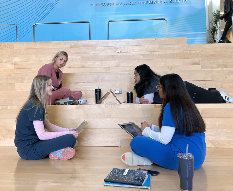 Blue Valley CAPS nursing student Sophia Cherafat (front left) talks to classmates (l-r) Reese Gaston, Sumehra Kabir and Jyoshika Padmanaban (Greg Toppo)<br>