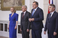 Elizabeth Truss Britain's Secretary of State for Foreign, Commonwealth and Development Affairs, poses with members of Bosnian presidency Sefik Dzaferovic, left, Zeljko Komsic, center and Milorad Dodikin Sarajevo, in Sarajevo, Bosnia, Thursday, May 26, 2022. (AP Photo/Armin Durgut)