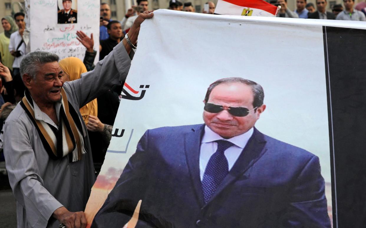 Supporters of Egyptian President Abdel Fattah al-Sisi in Tahrir square after presidential election results in Cairo - REUTERS