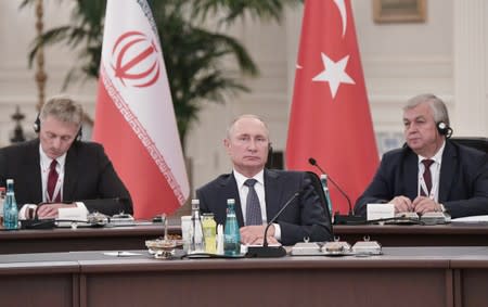 Russian President Putin is seen during trilateral talks with his counterparts Rouhani of Iran and Erdogan of Turkey in Ankara