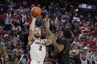 Gonzaga forward Drew Timme, left, shoots while defended by Kent State center Cli'Ron Hornbeak during the first half of an NCAA college basketball game, Monday, Dec. 5, 2022, in Spokane, Wash. (AP Photo/Young Kwak)