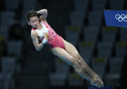 Quan Hongchan of China competes in women's diving 10m platform final at the Tokyo Aquatics Centre at the 2020 Summer Olympics, Thursday, Aug. 5, 2021, in Tokyo, Japan. (AP Photo/Dmitri Lovetsky)