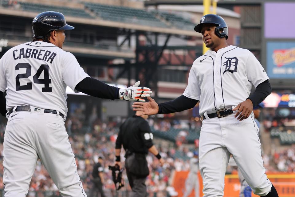 Tigers third baseman Jonathan Schoop celebrates scoring a run in the seventh inning with designated hitter Miguel Cabrera in the Tigers' 6-4 win over the Royals on Monday, June 19, 2023, at Comerica Park.