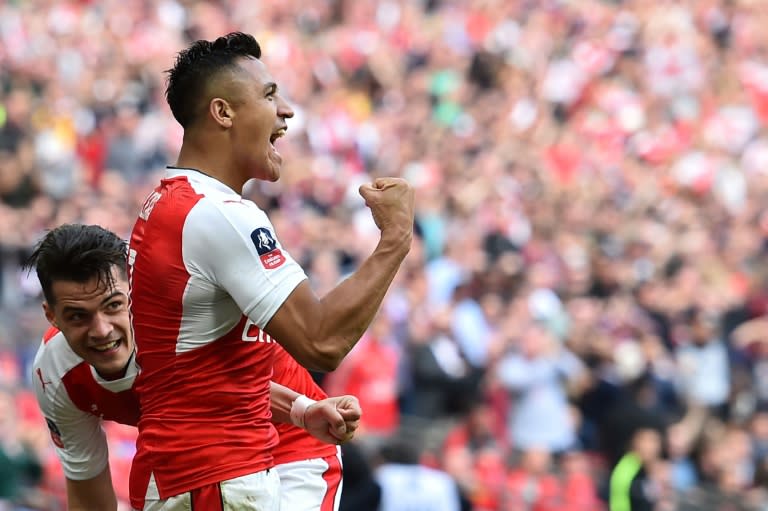 Arsenal's striker Alexis Sanchez (R) celebrates scoring against Manchester City at Wembley stadium in London on April 23, 2017