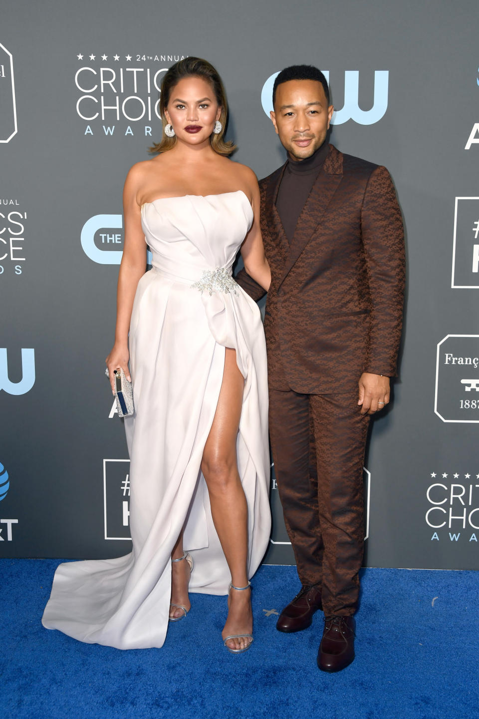 <p>Dress to the nines, Chrissy Teigen and John Legend swooned on the blue carpet. Source: Getty </p>