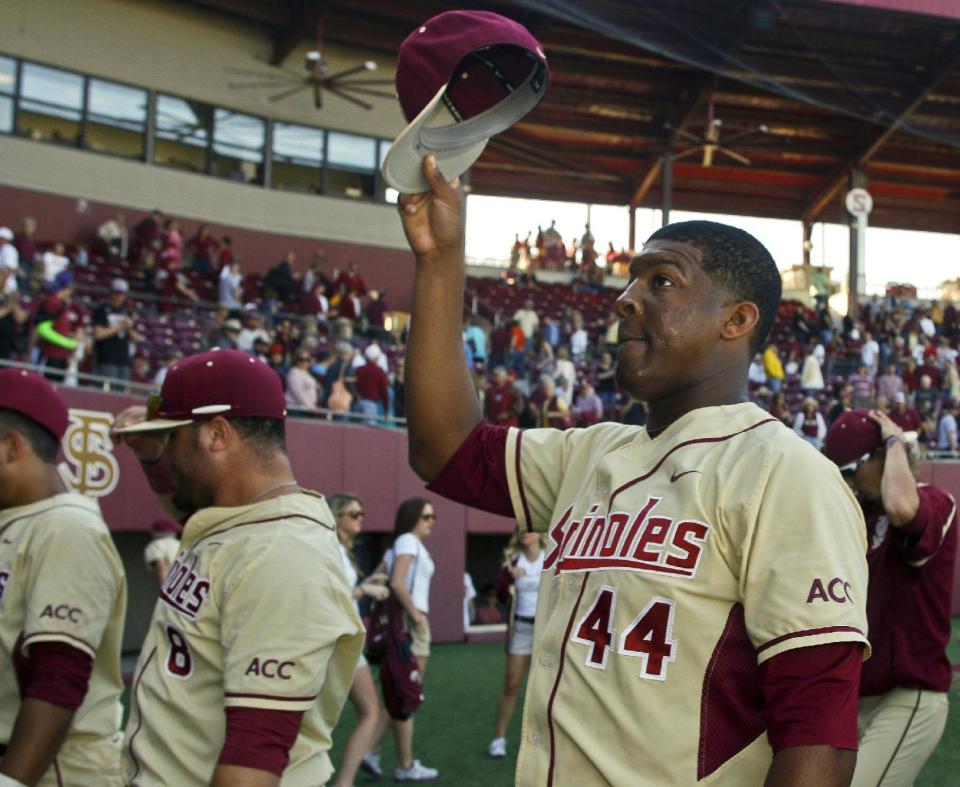 Florida State relief pitcher Jameis Winston (44) tips his cap to fans after an NCAA college baseball game against Miami on Sunday, March 2, 2014, in Tallahassee, Fla. Florida State won 13-6. (AP Photo/Phil Sears)