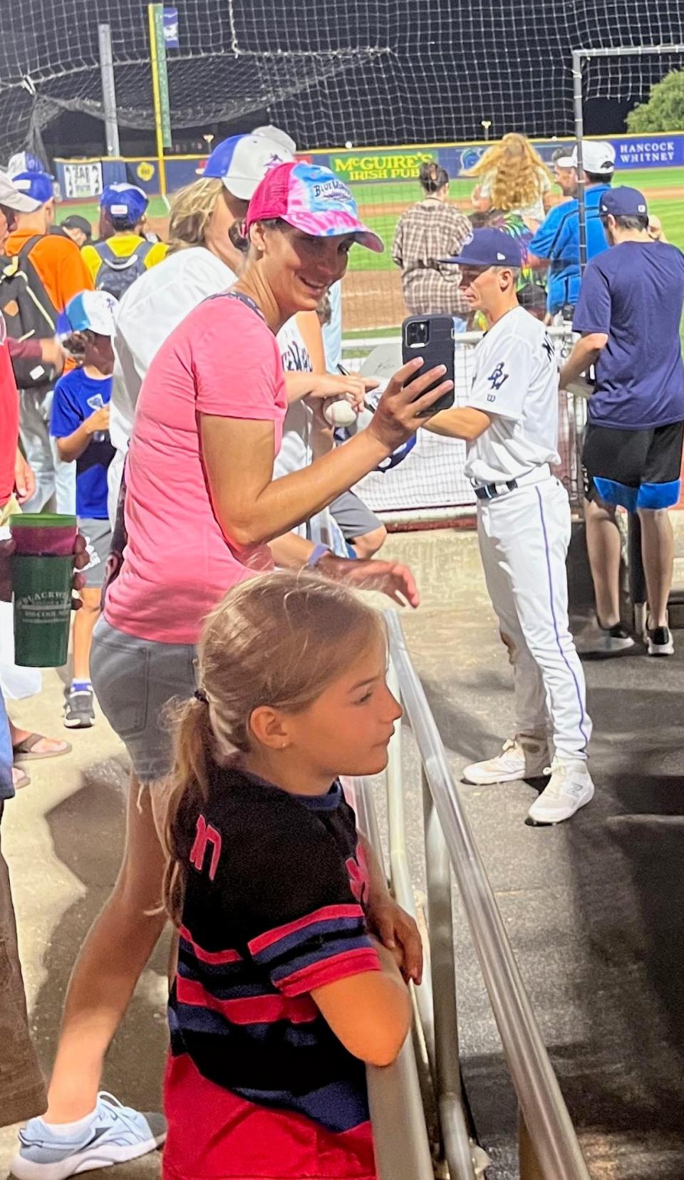 Cody Morissette, a 2018 graduate of Exeter High School, signs autographs prior to a Double-A baseball game between the Pensacola Blue Wahoos and the Mississippi Braves in Pensacola, Florida last summer.