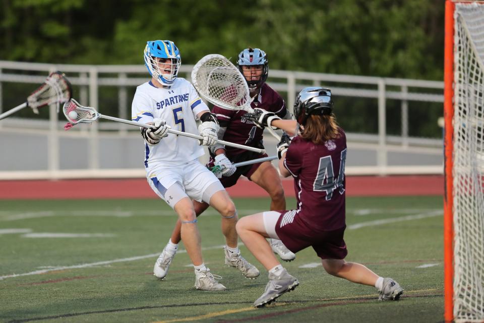 Maine-Endwell's Cullen Green takes a shot on goal against Johnson City's Christopher Kozlowski in the Section 4 Class C championship, Thursday, May 25, 2023.