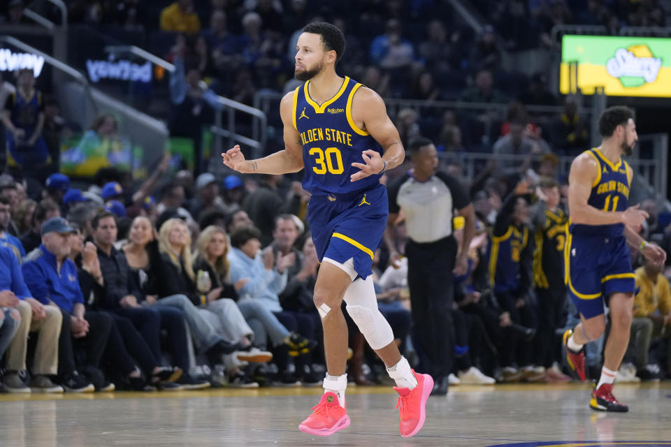 Golden State Warriors guard Stephen Curry (30) gestures after making a 3-point basket during the first half of an NBA basketball game against the Oklahoma City Thunder in San Francisco, Saturday, Nov. 18, 2023. (AP Photo/Jeff Chiu)