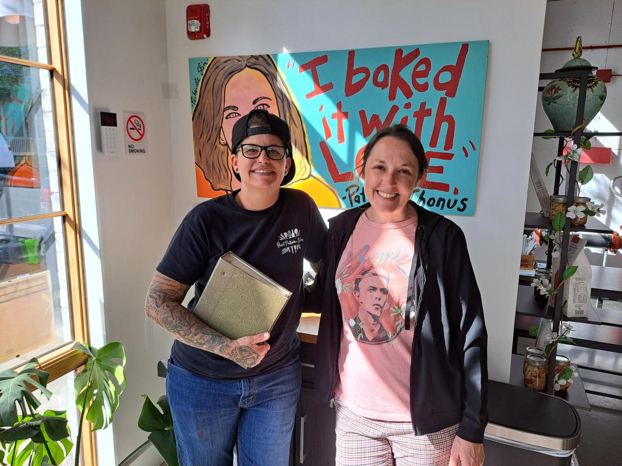 Andria (left) and Richelle Canella at Sweet Patricia's. Andria holds a green binder filled with her grandmother's, the restaurant's namesake, recipes.