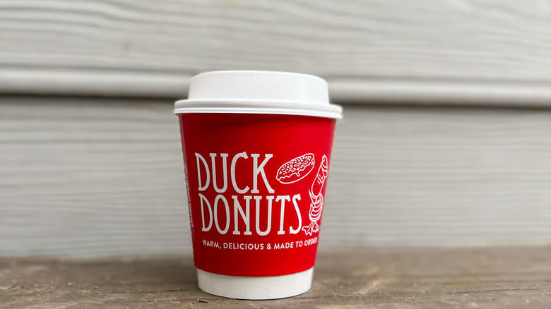 To-go cup of Duck Donuts hot chocolate