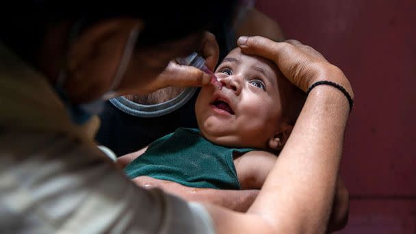 PHOTO: A health worker administers a dose of polio vaccine to a child during a national polio immunization drive in India, June 27, 2021. (Pradeep Gaur/Sopa Images/Sipa USA via AP, FILE)