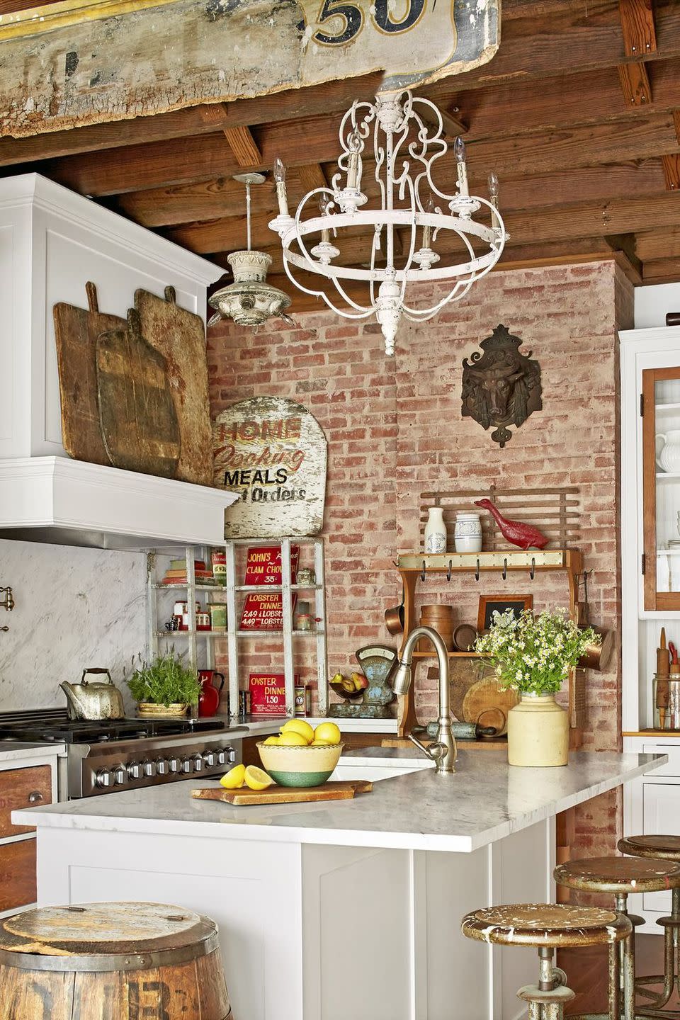 new kitchen filled with rustic wood and metal antiques